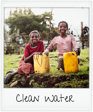 clean water - girls holding water jugs