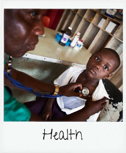 health - child getting check-up with health practitioner